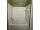 Shower and tub combo with white tiled walls at 4010 Santa Maria Dr # 106, Kissimmee, FL 34741