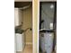 Utility closet with washer/dryer combo, water heater and HVAC system at 4010 Santa Maria Dr # 106, Kissimmee, FL 34741