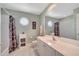 This bathroom features bright tile, a large vanity, and hexagon-shaped windows that provide natural light at 424 Curry Ct, Altamonte Springs, FL 32714