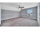 This spacious bedroom boasts neutral walls, soft carpeting, and natural light from the window at 424 Curry Ct, Altamonte Springs, FL 32714