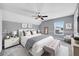 This primary bedroom offers a calm respite with its modern design, plush textiles, and comfortable sitting area at 424 Curry Ct, Altamonte Springs, FL 32714