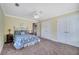 This cozy bedroom features a double closet, neutral carpet and a ceiling fan at 424 Curry Ct, Altamonte Springs, FL 32714