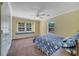 A sunny bedroom with plush carpet has a window seat nestled between large windows for reading at 424 Curry Ct, Altamonte Springs, FL 32714