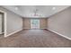 Spacious bonus room featuring neutral carpet, a ceiling fan, and access to the outdoor balcony at 424 Curry Ct, Altamonte Springs, FL 32714
