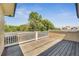 Outdoor deck showcasing wood flooring with a railing, providing views of the surrounding greenery at 424 Curry Ct, Altamonte Springs, FL 32714