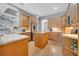 Well-lit kitchen featuring ample cabinet space, granite countertops, stainless steel appliances, and center island at 424 Curry Ct, Altamonte Springs, FL 32714