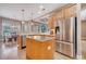 Bright kitchen with light wood cabinetry, granite countertops, stainless steel appliances, and a cozy breakfast nook at 424 Curry Ct, Altamonte Springs, FL 32714