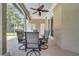 Covered lanai with an outdoor dining set, providing a comfortable space for enjoying meals and gatherings at 424 Curry Ct, Altamonte Springs, FL 32714