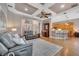 Open-concept living space featuring hardwood floors, a coffered ceiling, and seamless flow into the kitchen at 424 Curry Ct, Altamonte Springs, FL 32714