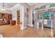 Spacious living area with hardwood floors and an open layout connecting the office, living room, and kitchen at 424 Curry Ct, Altamonte Springs, FL 32714