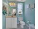 Bright powder room with vanity, mirror, and charming decor, adding a touch of elegance to the space at 424 Curry Ct, Altamonte Springs, FL 32714