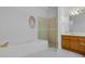 Bathroom featuring a soaking tub and glass-enclosed shower at 432 Valley View Dr, Winter Garden, FL 34787