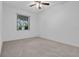 Bedroom featuring plush carpeting and natural light from the window at 432 Valley View Dr, Winter Garden, FL 34787