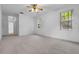 Bedroom with neutral carpet, ceiling fan and windows at 432 Valley View Dr, Winter Garden, FL 34787