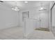 Bright entryway featuring tiled floors, decorative lighting, and a clear view of the home's interior layout at 432 Valley View Dr, Winter Garden, FL 34787