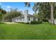 Well-maintained exterior with lush lawn, charming details, and attached garage at 432 Valley View Dr, Winter Garden, FL 34787
