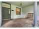 Cozy covered porch featuring brick flooring, a rocking chair, and views of the front yard, perfect for relaxation at 432 Valley View Dr, Winter Garden, FL 34787