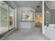 Covered patio with easy access to kitchen and views of the screened lanai at 432 Valley View Dr, Winter Garden, FL 34787