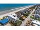 Beautiful aerial view showcasing a luxury home near a beach, featuring well-maintained landscaping and neighborhood charm at 4647 Van Kleeck Dr, New Smyrna Beach, FL 32169