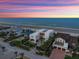 Beautiful aerial view of a luxury home, near the ocean, showcasing landscaping and a desirable neighborhood at 4647 Van Kleeck Dr, New Smyrna Beach, FL 32169