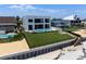 Gorgeous home with a pool and manicured lawn, offering direct beach access for a luxurious coastal lifestyle at 4647 Van Kleeck Dr, New Smyrna Beach, FL 32169