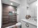 Modern bathroom featuring a glass-enclosed shower with stone floor, sleek vanity at 4647 Van Kleeck Dr, New Smyrna Beach, FL 32169