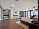 Stylish bedroom with a fireplace, an ocean view, and modern decor, creates a luxurious and relaxing retreat at 4647 Van Kleeck Dr, New Smyrna Beach, FL 32169