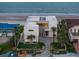 Contemporary home showcasing modern architecture, lush landscaping, and ocean views at 4647 Van Kleeck Dr, New Smyrna Beach, FL 32169