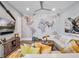 Stylish living room with a world map wall, comfortable seating, and aviation-themed decor at 4647 Van Kleeck Dr, New Smyrna Beach, FL 32169