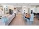 Open-concept living room and dining area featuring modern furniture, neutral tones, and a bright, inviting atmosphere at 4647 Van Kleeck Dr, New Smyrna Beach, FL 32169