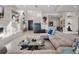 Open-concept living room with modern decor, tile accent wall, and stylish furnishings at 4647 Van Kleeck Dr, New Smyrna Beach, FL 32169