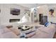 Stylish living room with a modern fireplace, floating shelves, and comfortable seating at 4647 Van Kleeck Dr, New Smyrna Beach, FL 32169