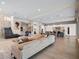Open-concept living space with modern finishes, a staircase, and a gourmet kitchen at 4647 Van Kleeck Dr, New Smyrna Beach, FL 32169