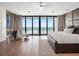 Spacious main bedroom features hardwood flooring, seating area, and ocean views at 4647 Van Kleeck Dr, New Smyrna Beach, FL 32169