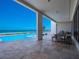 Spacious patio with stunning ocean views, perfect for outdoor dining at 4647 Van Kleeck Dr, New Smyrna Beach, FL 32169