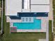 Aerial view of a modern pool featuring tiled loungers and a fire pit at 4647 Van Kleeck Dr, New Smyrna Beach, FL 32169