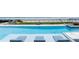 Luxury home pool featuring tiled loungers and beachfront access at 4647 Van Kleeck Dr, New Smyrna Beach, FL 32169