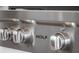 Close-up of a Wolf range featuring stainless steel knobs, showcasing the high-end appliance in the kitchen at 4647 Van Kleeck Dr, New Smyrna Beach, FL 32169