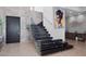 Modern staircase with glass railings and decorative art, located in entry at 4647 Van Kleeck Dr, New Smyrna Beach, FL 32169