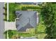 Aerial view of the home showcasing the roof, landscaping and outdoor patio area at 468 Alinole Loop, Lake Mary, FL 32746