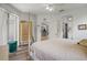 Serene bedroom featuring ample space, wood floors, and access to the backyard at 468 Alinole Loop, Lake Mary, FL 32746