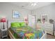 Cozy bedroom features neutral paint, ceiling fan, and sunny window at 468 Alinole Loop, Lake Mary, FL 32746