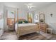 Comfortable bedroom with wood floors, natural light, and neutral decor at 468 Alinole Loop, Lake Mary, FL 32746