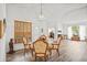 Elegant dining area featuring wood-look flooring, a chandelier, and access to other rooms for seamless entertaining at 468 Alinole Loop, Lake Mary, FL 32746