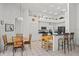 Well-lit kitchen with modern appliances, white cabinets, and an adjacent dining area for convenient meals at 468 Alinole Loop, Lake Mary, FL 32746
