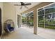 Covered lanai with screened-in porch and ceiling fan overlooking the backyard at 468 Alinole Loop, Lake Mary, FL 32746