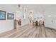 Open-concept living room featuring wood-look flooring, high ceilings, and arched doorways offering a spacious design at 468 Alinole Loop, Lake Mary, FL 32746