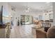 Bright living area with tile flooring, high ceilings, and sliding glass doors leading to an outdoor space at 468 Alinole Loop, Lake Mary, FL 32746
