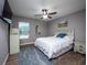 Bedroom overlooking the pool offers a ceiling fan, neutral walls, and a comfortable atmosphere for relaxation at 485 Nw 71St Ave, Ocala, FL 34482