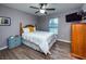 Inviting bedroom with a large window, ceiling fan, and neutral paint, creating a serene and restful space at 485 Nw 71St Ave, Ocala, FL 34482